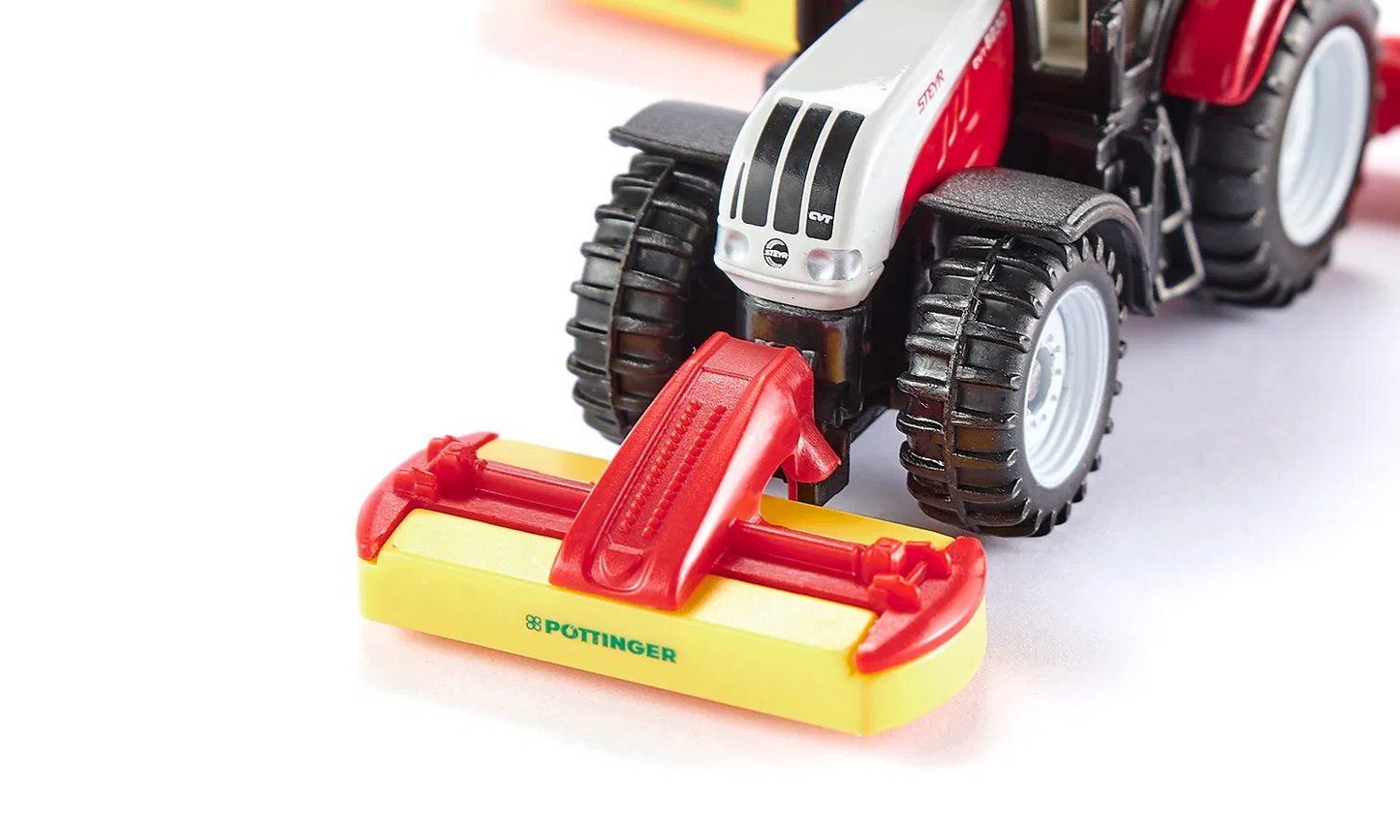 Steyr mit Pöttinger Mähwerkskombination
